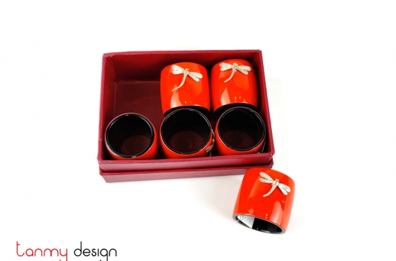 Set of 6 orange napkin rings attached with dragonfly
